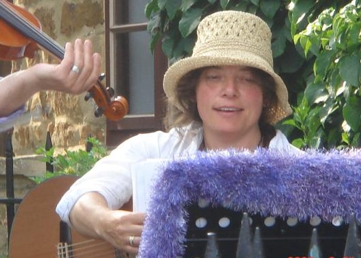 Jo, with hat and decorated music stand