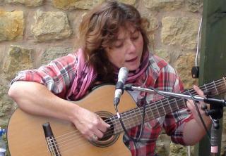 Joplaying guitar